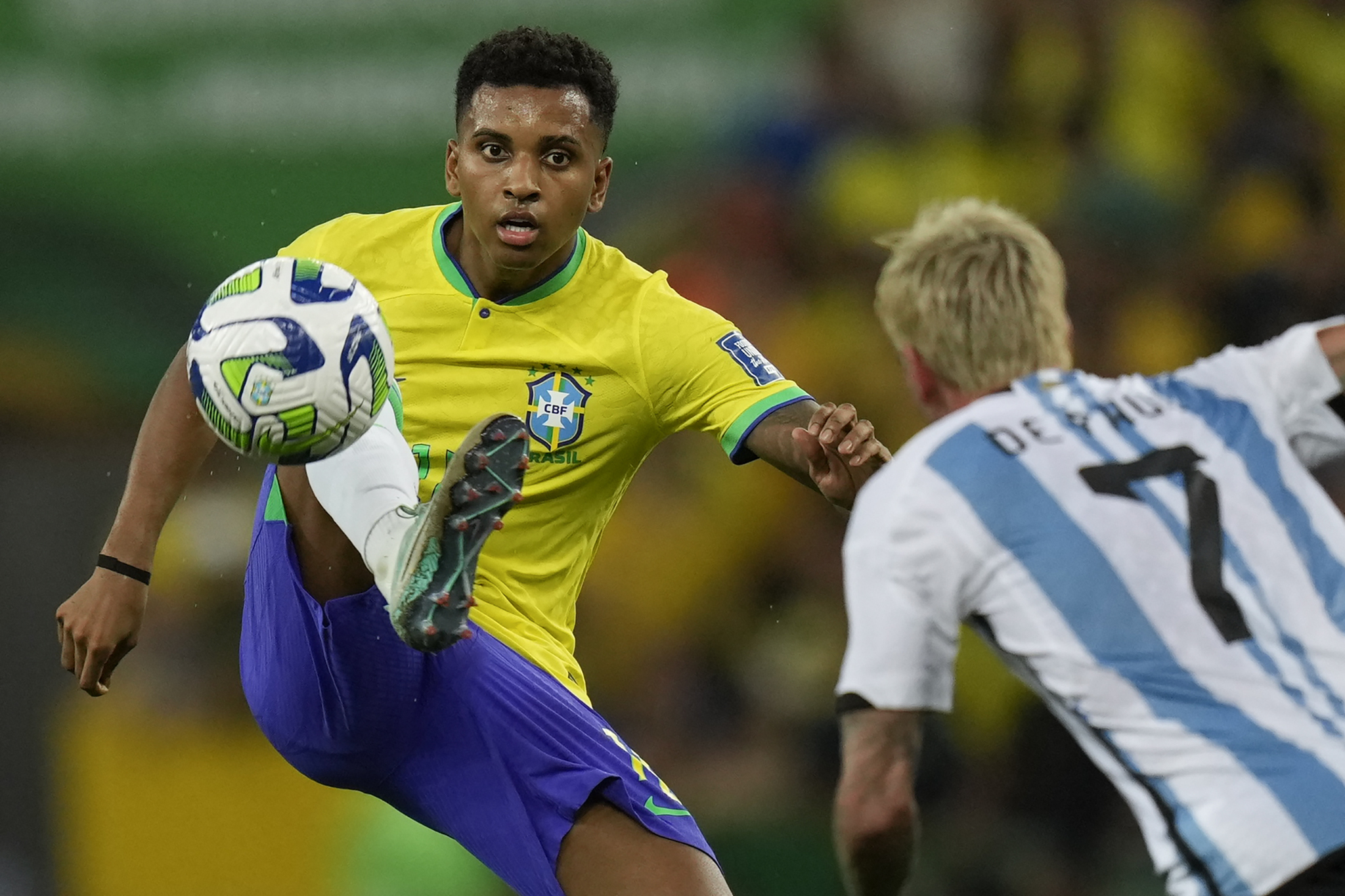 Brazil's Rodrygo controls the ball challenged by Argentina's Rodrigo De Paul